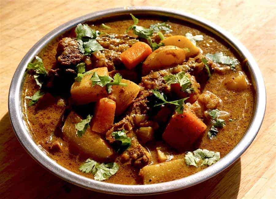 A thick Cape Malay brown curry with lamb, carrots, potatoes and parsley