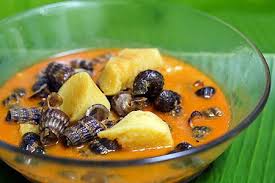 An orange curry with sea snails called balitong