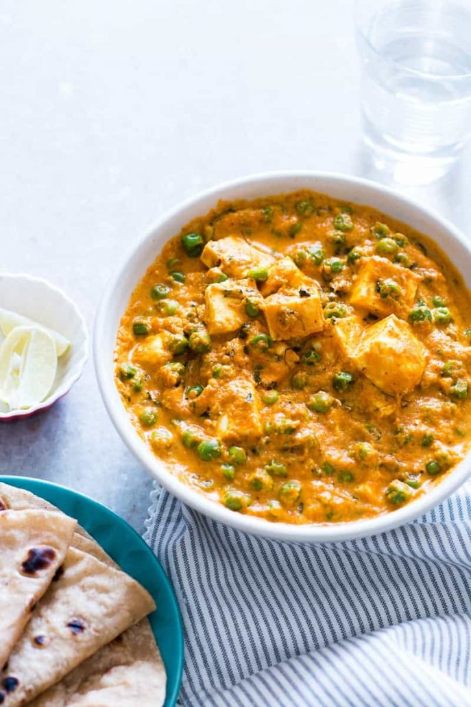 Matar paneer, a creamy yellow curry with chunks of Indian cottage cheese and peas