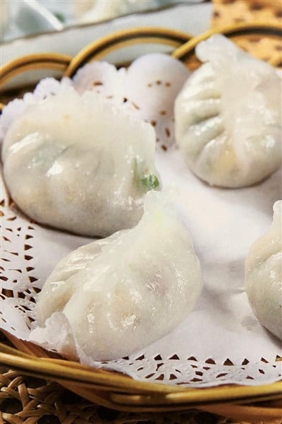 Dumplings with slightly translucent skin, filled with pork and mushrooms