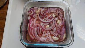 Pickled onions in a container